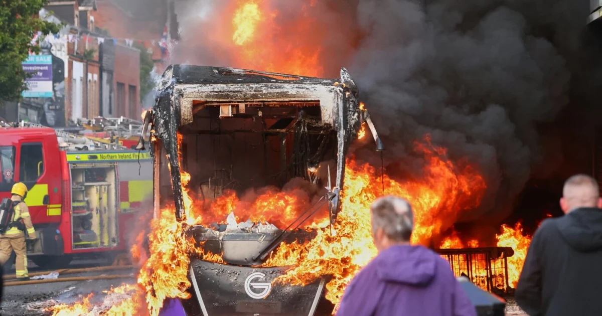 Belfast unrest erupts after stabbing, cars and bus set on fire