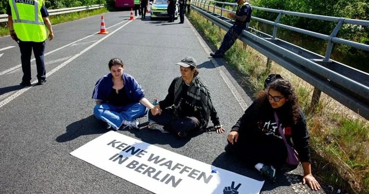 Protesters block Berlin air show roads, forcing delegates to walk