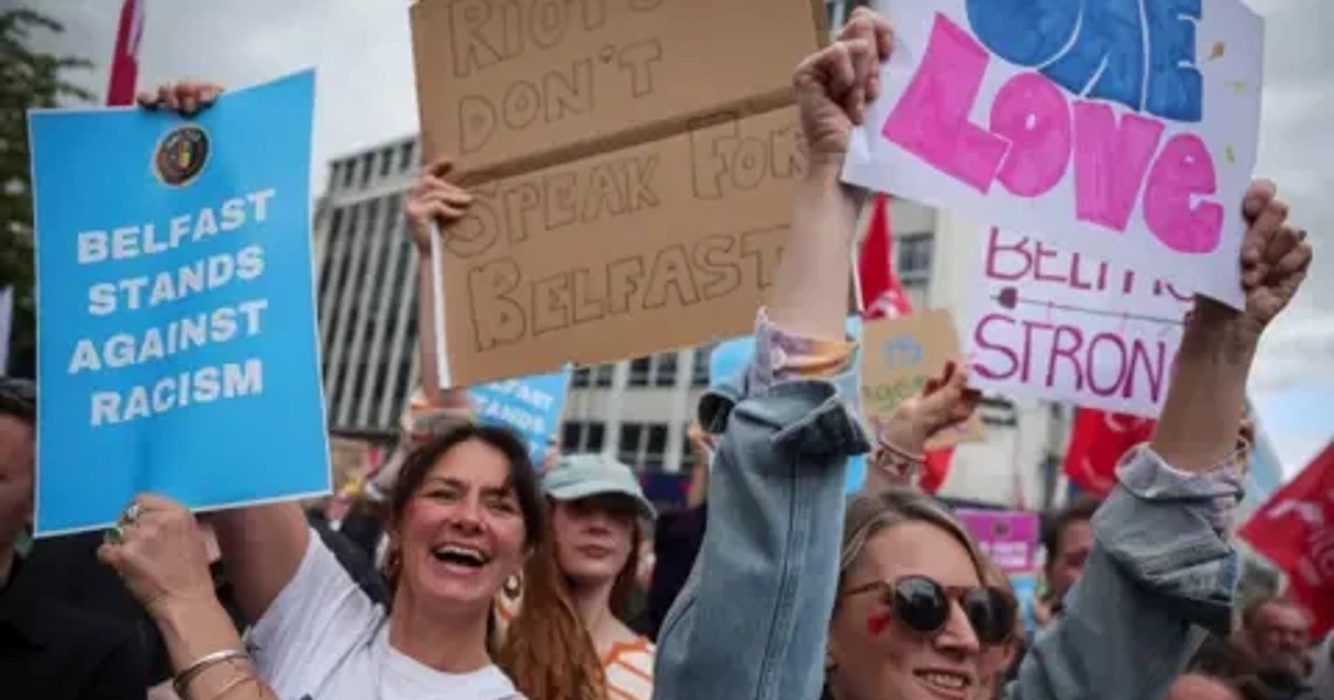 Thousands rally in Belfast against racism after days of unrest