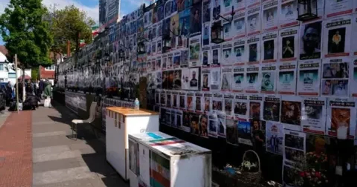 Arson charge after fire at Iran protest memorial wall in London