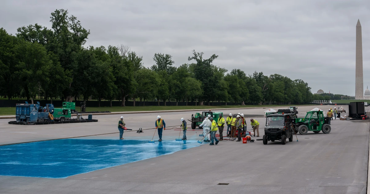 Washington’s Reflecting Pool turns green as blue paint peels off bottom
