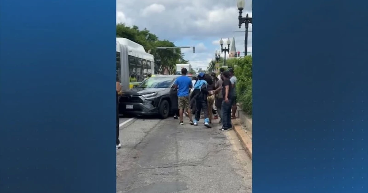Boston crowd restrains suspect after fatal crash and carjacking