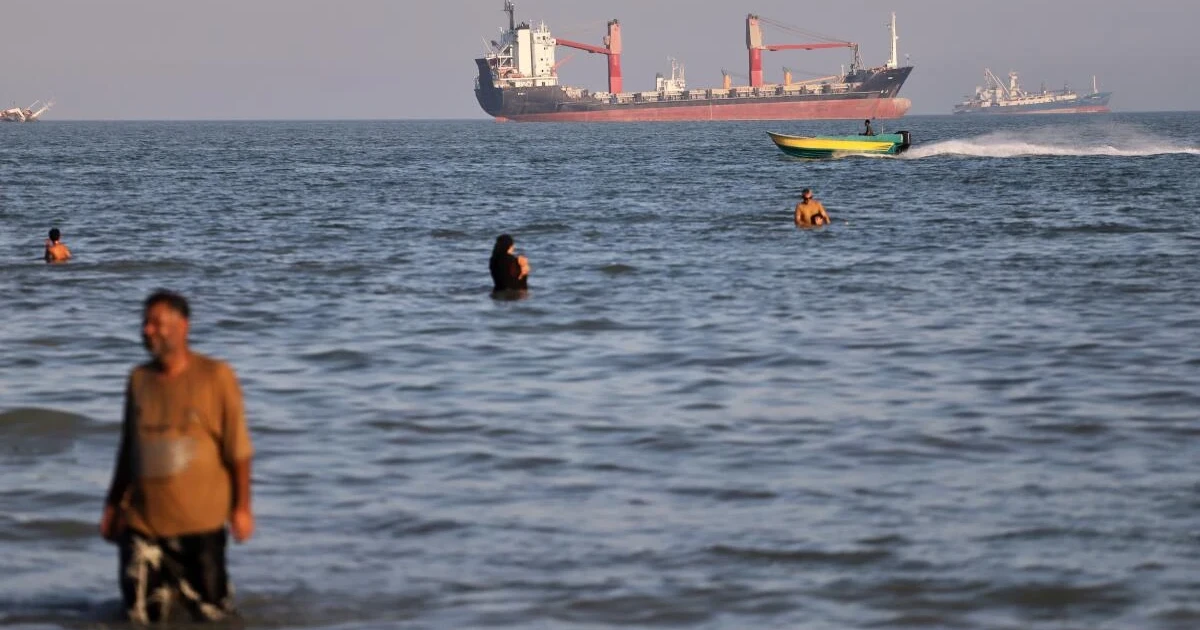 IMO pauses Hormuz evacuation after cargo ship hit near Oman