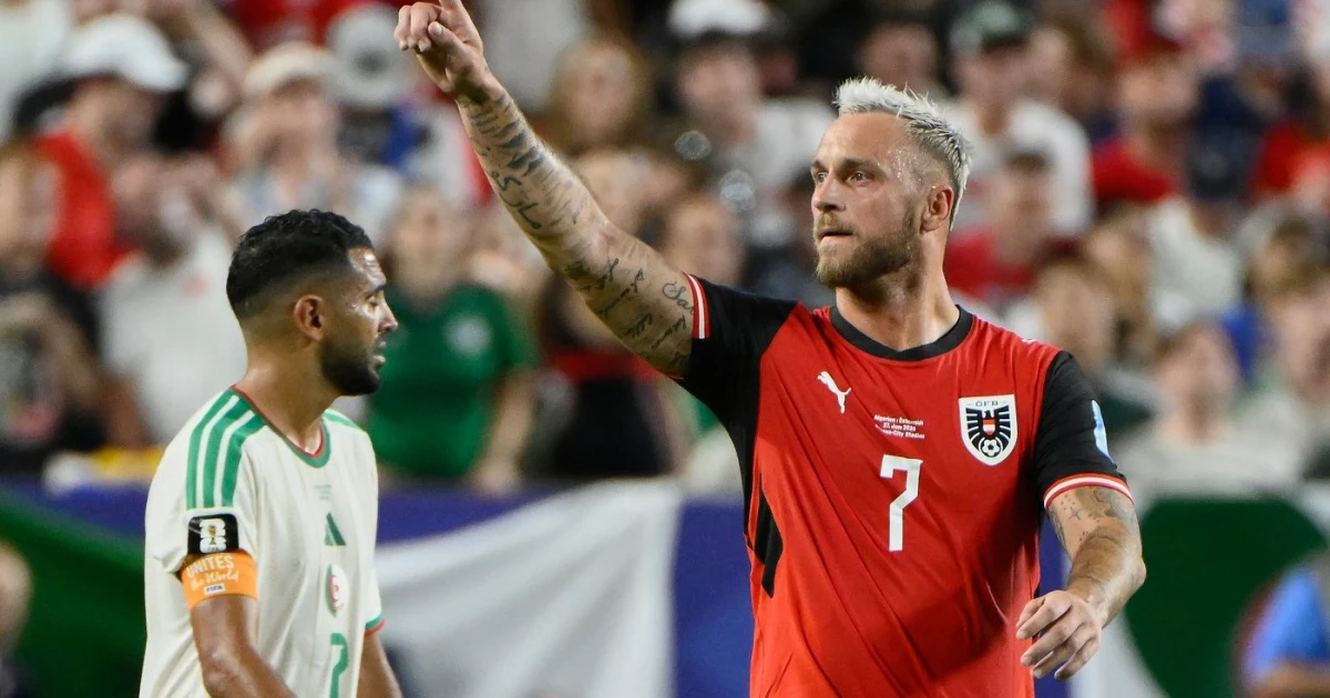 Mahrez scores twice as Algeria draws Austria to reach knockout stage