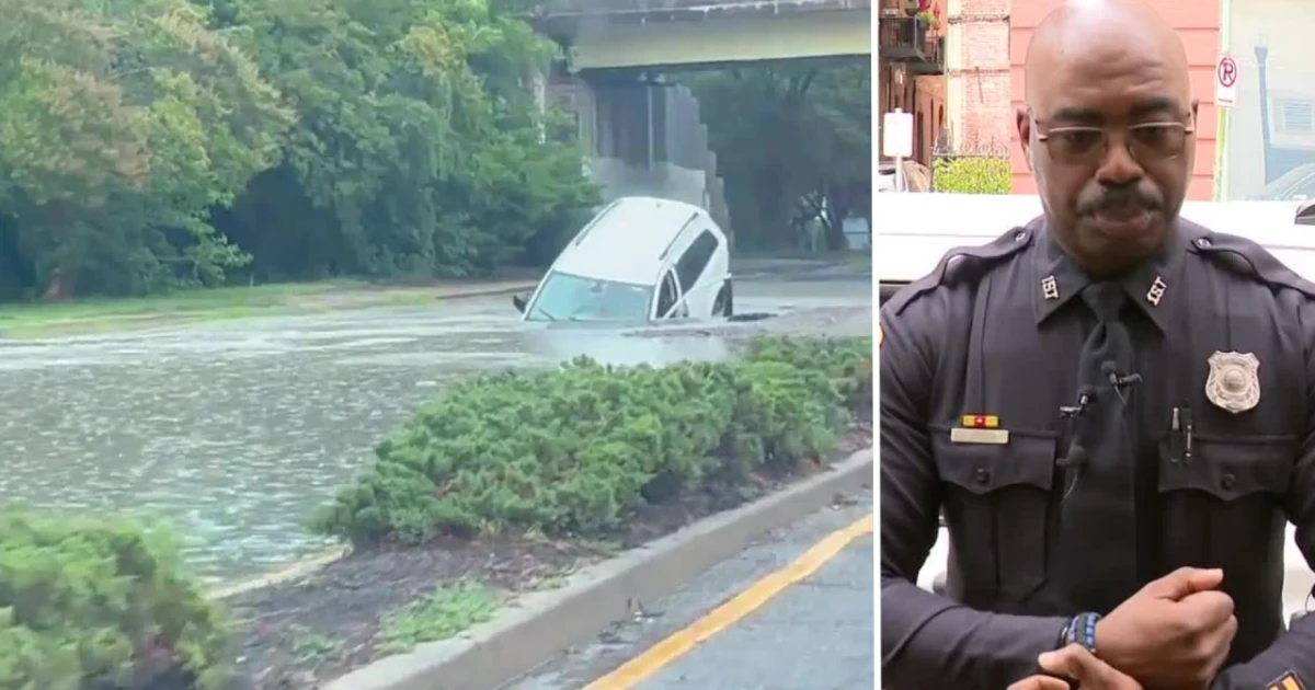 Norfolk officer rescues woman from car submerged in sinkhole