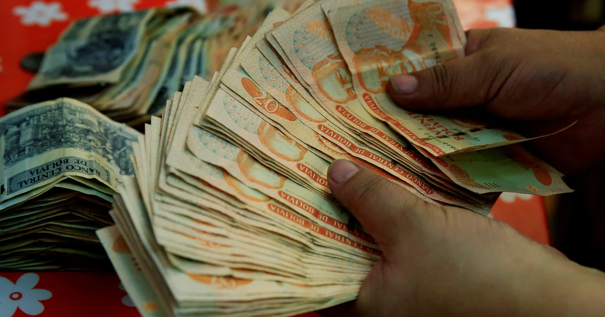 Bolivia ends fixed exchange rate, devalues currency by 30%