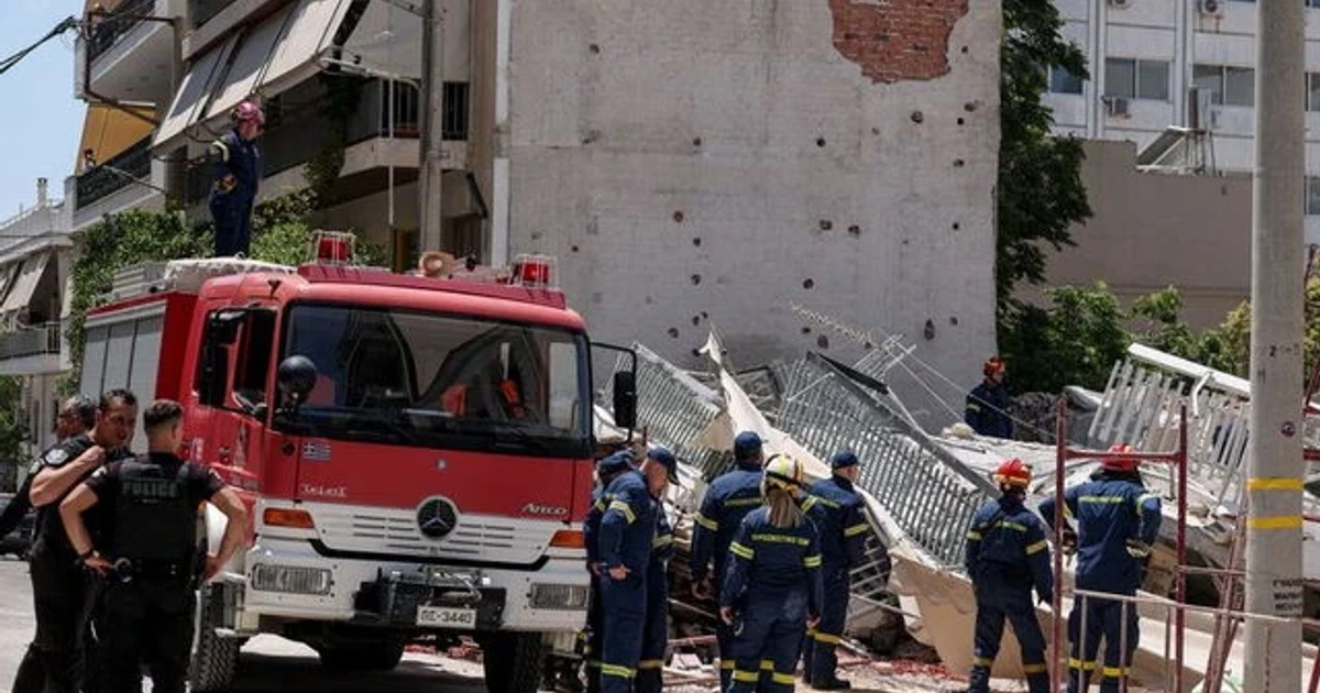 Greek rescuers search collapsed Athens apartment block after four are found safe