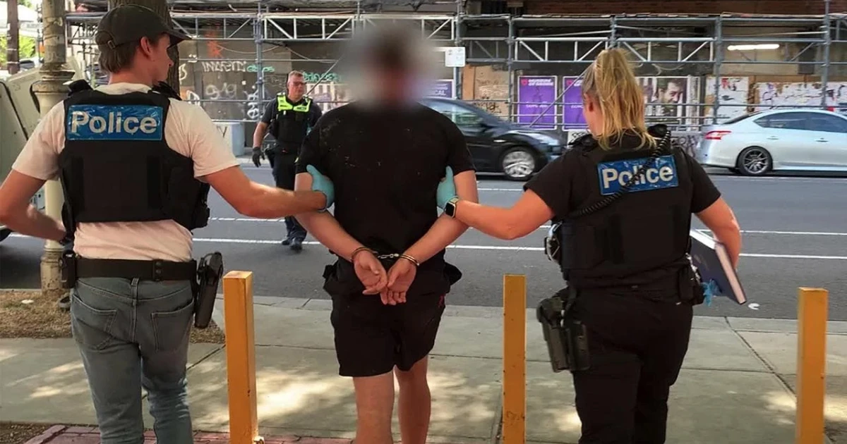 Man arrested after hourslong Melbourne bridge tower standoff and graffiti scare