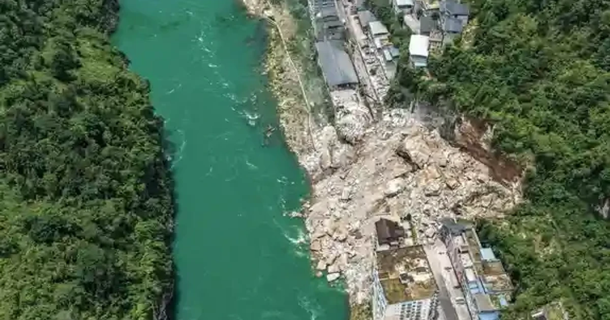 Rescue crews search for survivors after landslide traps people in southwest China