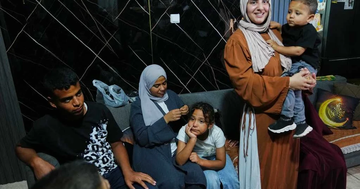 Palestinian family reunites briefly at Israel-Gaza crossing after war splits them